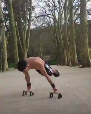 Calisthenics athlete doing planche on parallettes