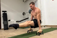 Male athlete doing L-sit on Antlettes