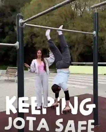 Female athlete doing exercises on parallettes