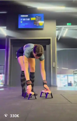 Female athlete using parallettes
