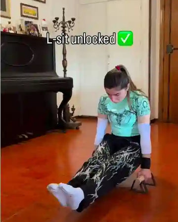 Female athlete teaching L-sit exercise