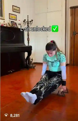 Female athlete teaching L-sit exercise