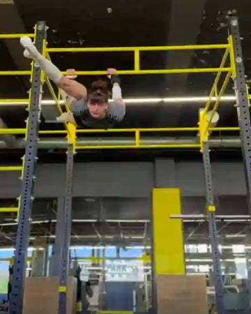 Female athlete doing bar workout
