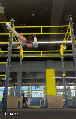 Female athlete doing bar workout