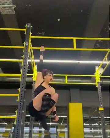Female athlete doing hanging l-sit