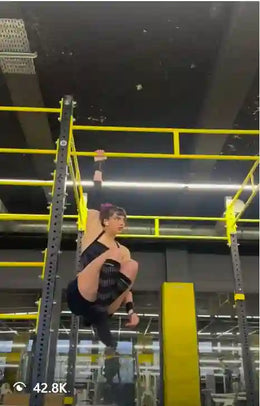 Female athlete doing hanging l-sit