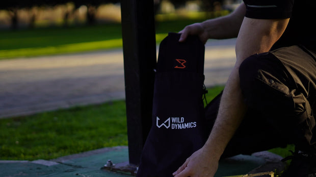 Person sitting using dip belt of wild dynamics