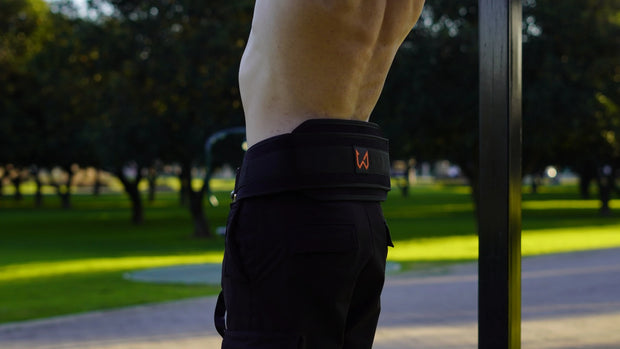 person wearing black dip belt