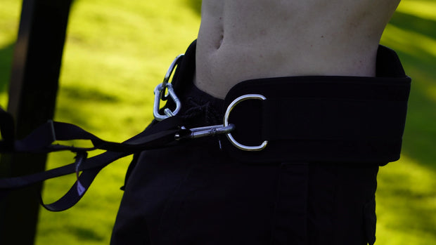 Close-up of a black dip belt with rope