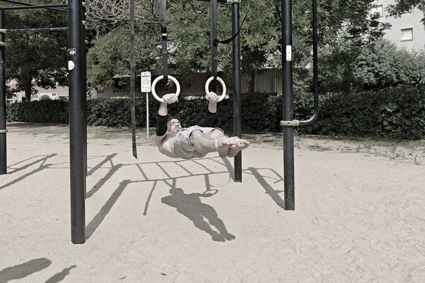 Athlete doing front lever on rings